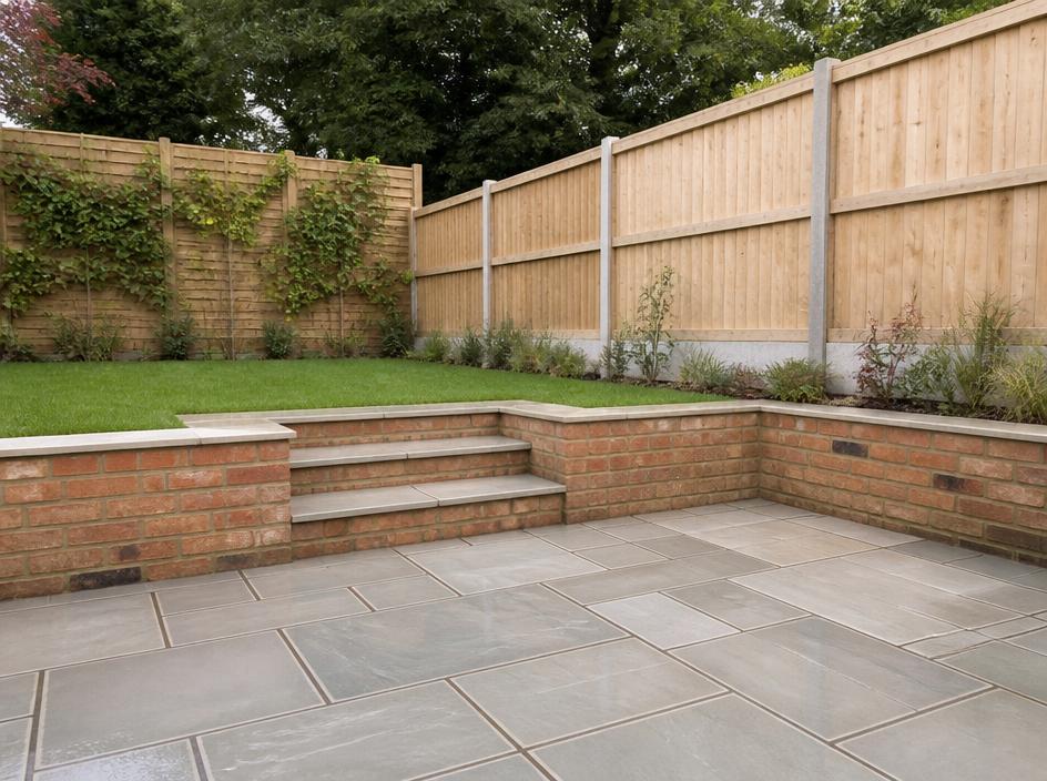 New sandstone patio, timber fencing and brick retaining wall with steps