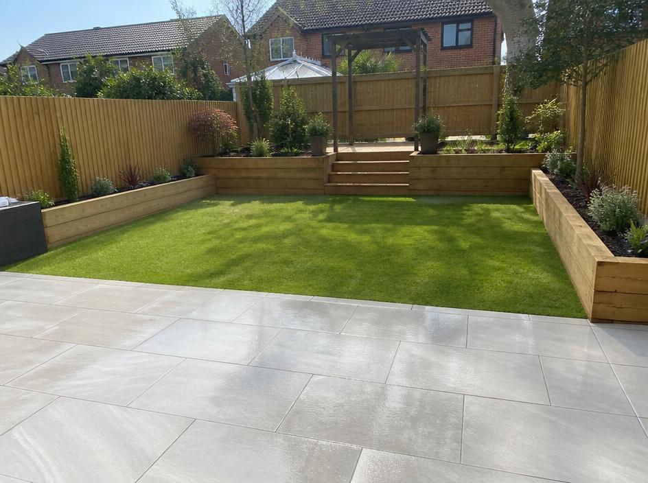 Transformed garden with new patio, lawn and raised sleeper beds