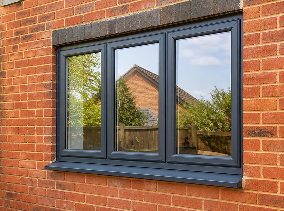 New anthracite grey uPVC windows on a brick house